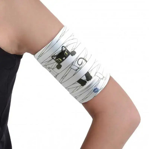 Children's armband protecting blood glucose sensor and pod with cute cat design.