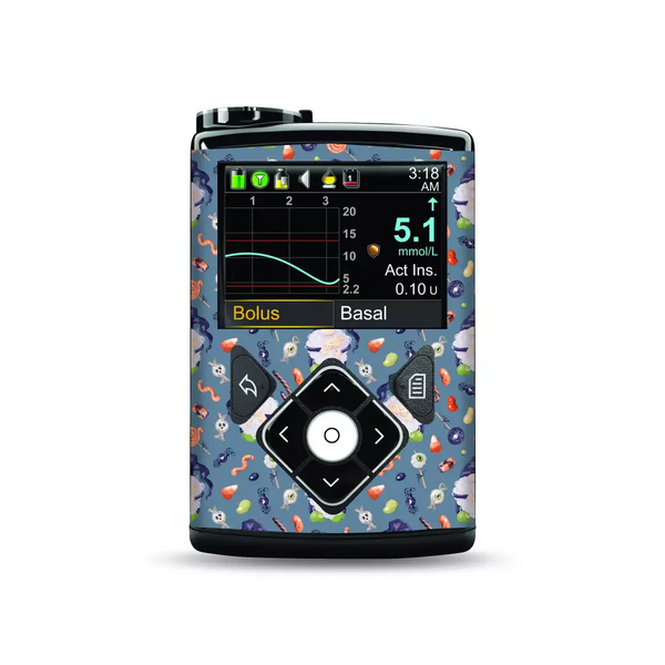 Medtronic MiniMed insulin pump with Halloween-themed stickers featuring bats, pumpkins, and ghosts.