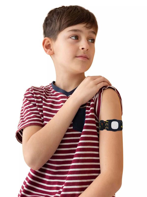 Child wearing Simplera Sync Armband with Rotating Clip for Medtronic Simplera sensor, showcasing secure fit and playful design.