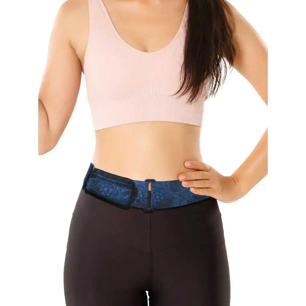 Multipurpose belt for diabetics with attached insulin pump pouch on a person.