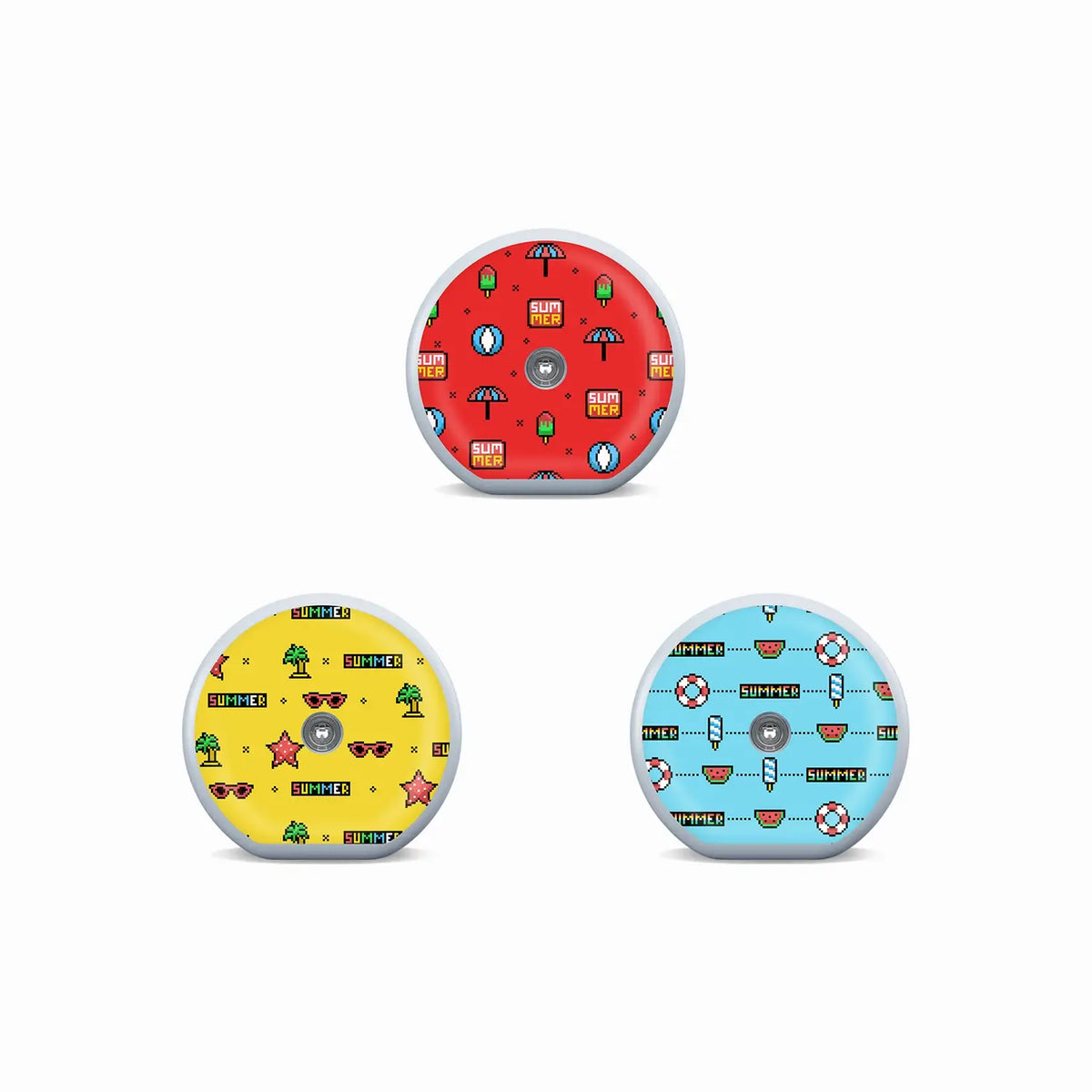 Three Accu-Chek SmartGuide sensor stickers in red, yellow and blue pixel-art designs with playful summer icons. Obraz
