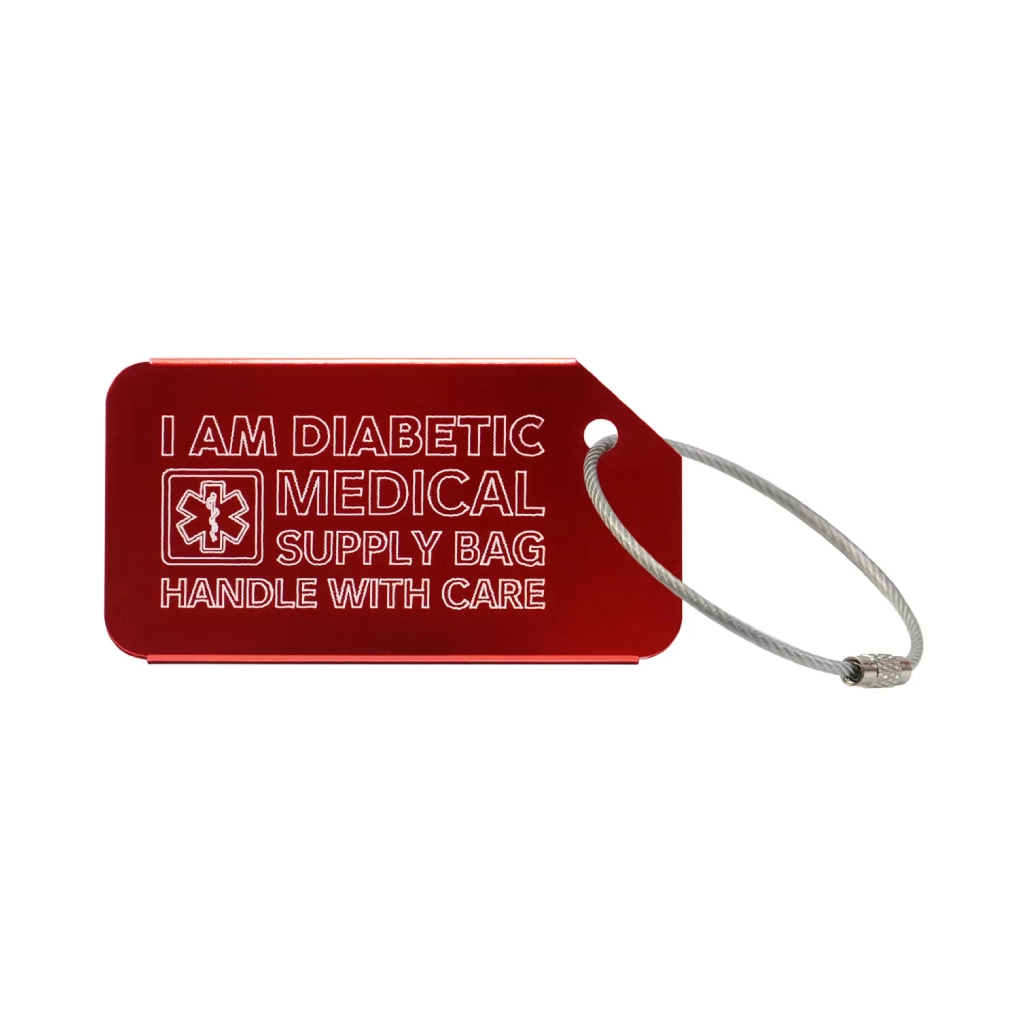 Red medical luggage tag with the text 'I Am Diabetic Medical Supply Bag Handle With Care' engraved. Obraz