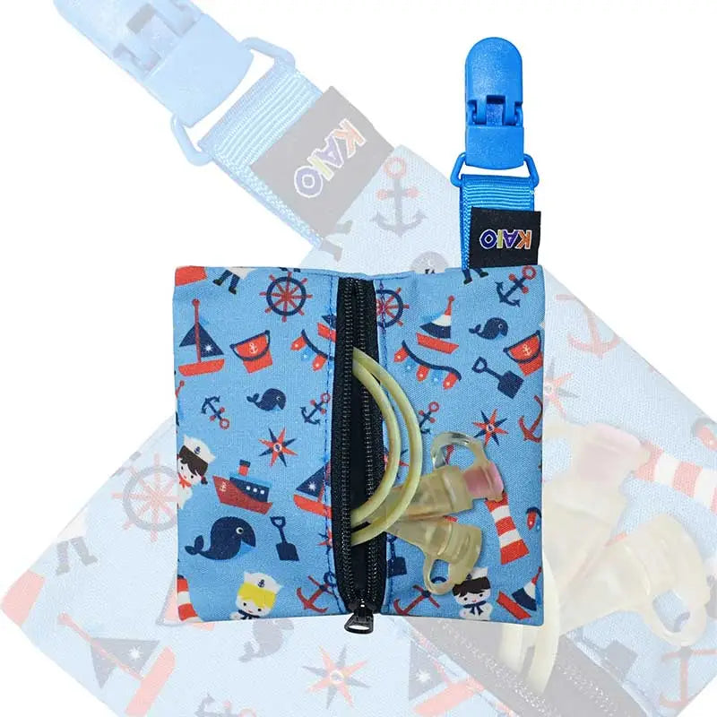 Kaio-Tube Pouch for children's medical tubing, a compact blue fabric pouch with a nautical print and black zipper. Obraz