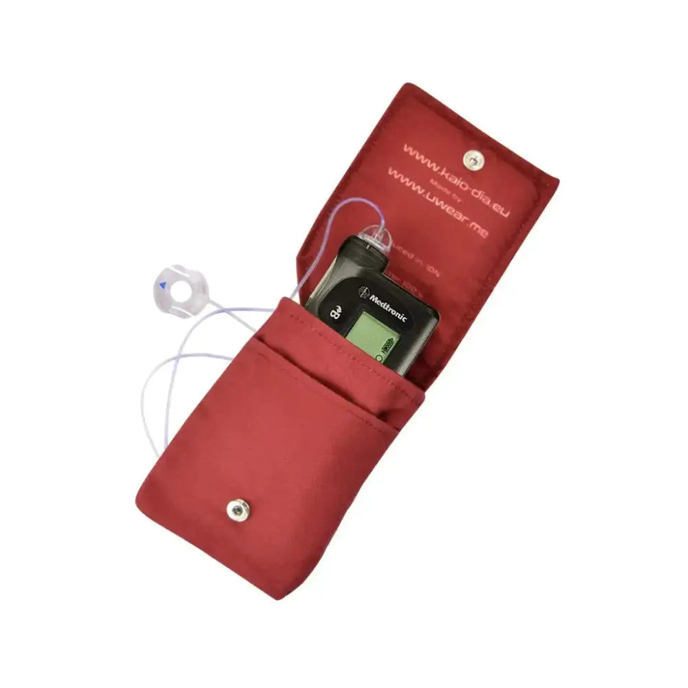 Open red insulin pump pouch holding an insulin pump Obraz