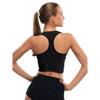 Woman wearing black crop top designed for insulin pump with integrated pockets, showcasing back view.