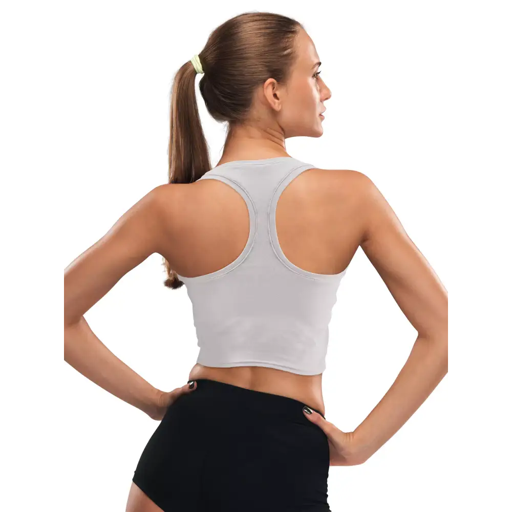 Woman wearing grey insulin pump adaptive crop top and black shorts, showcasing back and fit.