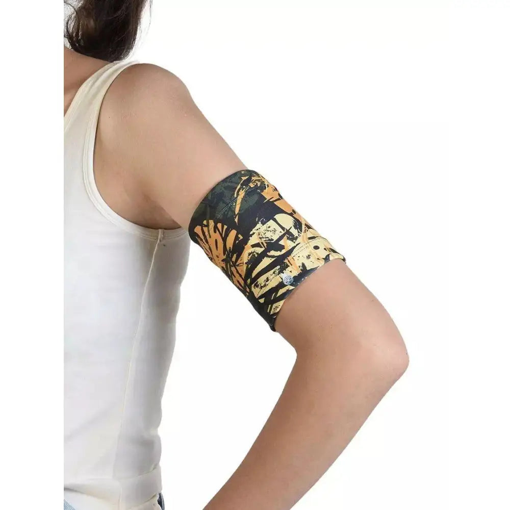Blood Glucose Monitor Armband in use, elastic band protecting glucose sensor, floral design, ideal for sports and swimming.