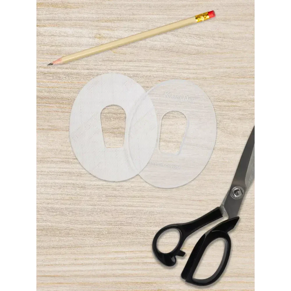CGM sensor patch template with scissors and pencil for custom patch creation.