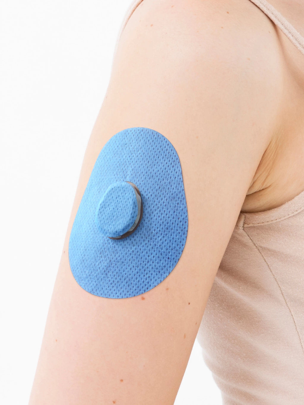 Plaster mocujący do Dexcom G7, kształt: kropla, na ramieniu, zbliżenie