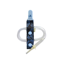 medical feeding tube clip attached to tube showing secure grip and proper positioning for feeding tube support