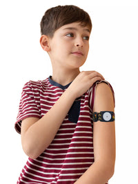 Child wearing Freestyle Libre 2 armband in Roar print for comfort and sensor protection.