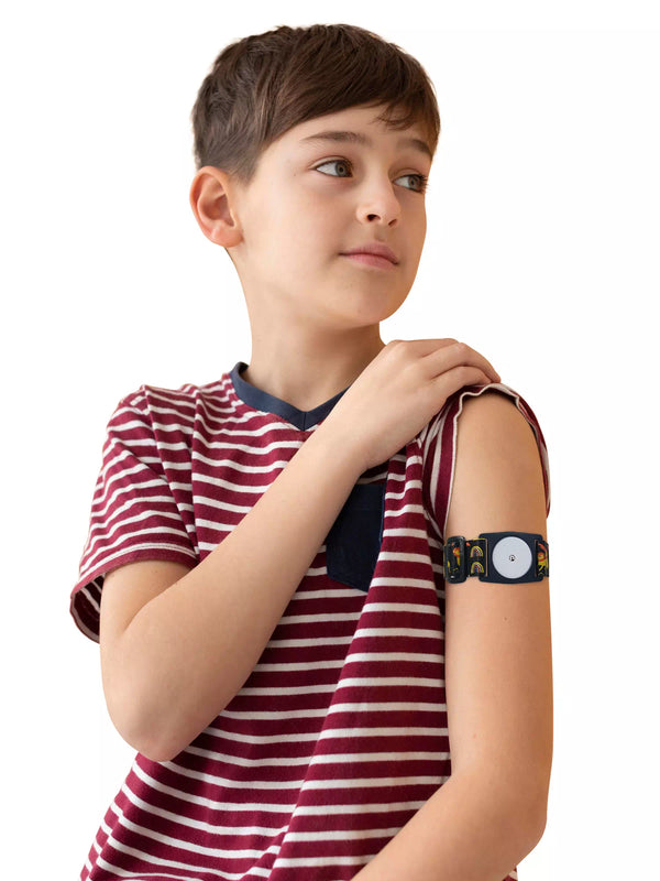 Child wearing Freestyle Libre 2 armband in Roar print for comfort and sensor protection.