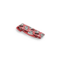 Freestyle Libre 2 sensor adjustable armband for children with playful red and white design.
