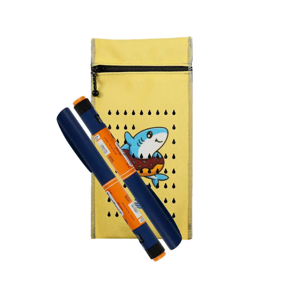 Insulin cooling wallet for kids with playful shark design, fits two insulin pens, maintains optimal temperature for 48 hours.