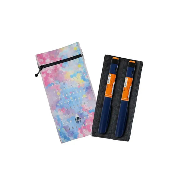 Insulin cooling wallet holding two insulin pens with tie-dye design, compact and portable.