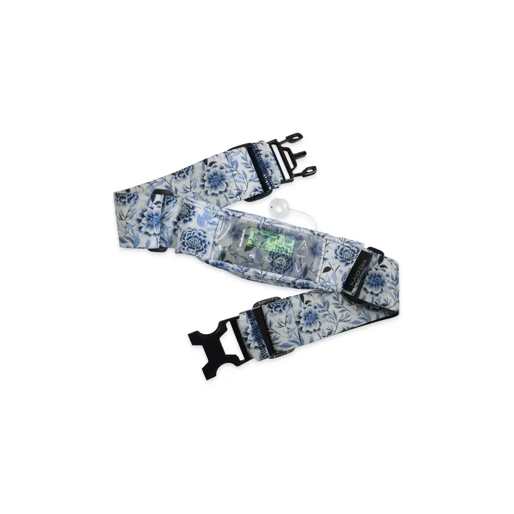 Insulin pump belt with window featuring floral design, secure fit, and easy monitoring.
