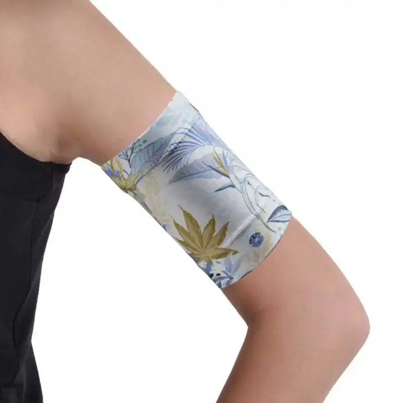 Armband for blood glucose monitor with floral pattern, ensuring secure fit for sports and swimming.