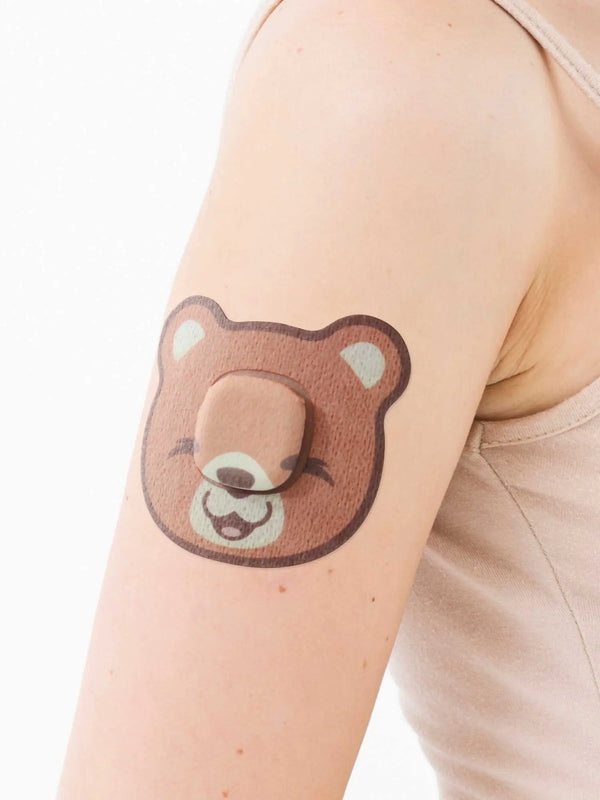 Simplera Sync bear patch worn on arm kids CGM adhesive patch for reliable fixation and skin friendly use