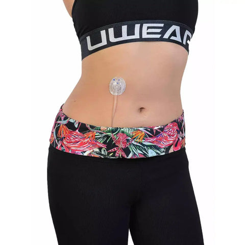Floral print insulin pump waist belt providing comfort and secure storage for active use.
