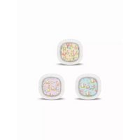 Three fluffy-edged cushions featuring Medtronic Simplera CGM Easter Edition 2025 patterns