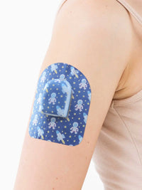 Plaster mocujący do poda Omnipod, wzór Astronaut, na ramieniu