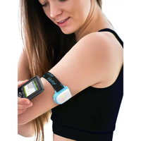 Omnipod insulin patch pump adjustable armband with colored clip in use on woman's upper arm.